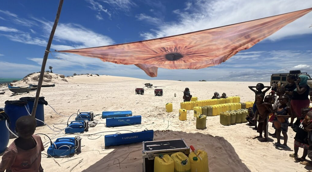 Villagers gathering jerrycans of filtered drinking water in Tsiandamba